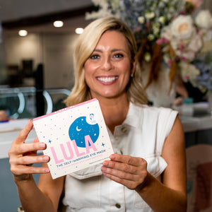 Employee receiving a Christmas gift of Lula self-warming eye masks